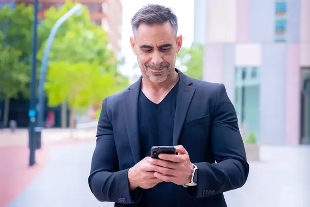 A sales manager checks the pipeline on a phone